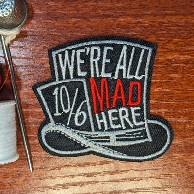 We're All Mad Here Mad Alice in Wonderland Patch Embroidered Iron On 2.5x2.5" - Image 1 of 3