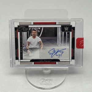 2024 PANINI TRES CUENTAS WWE CM PUNK MOMENTOS ATEMPORALES AUTOMÁTICO/99 - Imagen 1 de 2