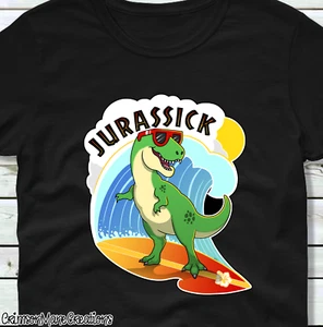 T Rex T Shirt Dinosaur Surfing Funny Cute Jurassic Park Kids Ladies Mens Sizes - Picture 1 of 9