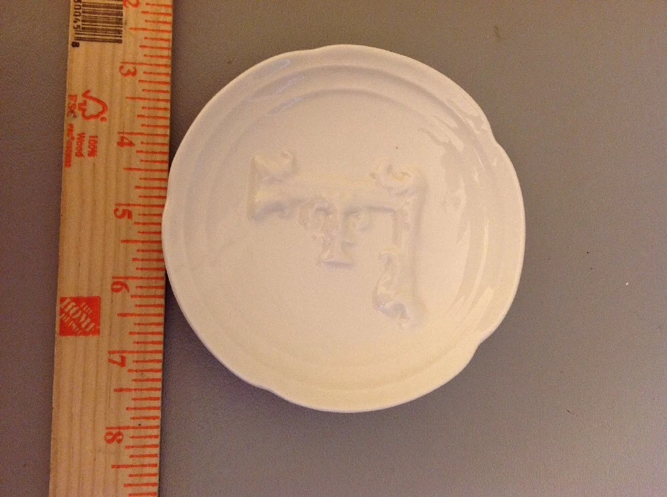 Pie de barro placa inicial F Foto 1 de 4