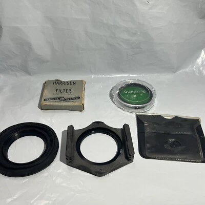 Quantaray 49mm lens filter Green, Harrison Yellow In Tin Miscellaneous Items Lot - Image 1 of 4