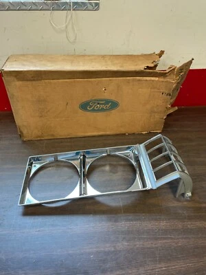 1974 1975 MERCURY METEOR MONTCALM LH HEADLIGHT BEZEL DOOR NOS FORD 621 - Image 1 of 4
