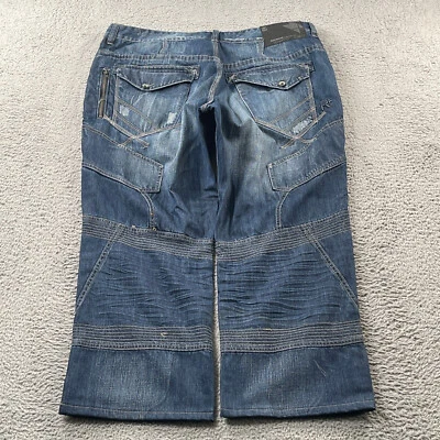 Pantalones de mezclilla Rocawear para hombre 42x30 cono retazos solapa bolsillo holgado lema NUEVO Foto 1 de 4