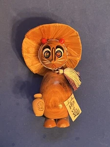 Wooden Japanese Kokeshi Tanuki (Raccoon dog) with hat, sake bottle, bow, sign - Picture 1 of 4