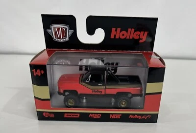 M2 Machines DICAST 4x4 New Square Body CHEVY pickup Truck HOLLY Black Orange - Image 1 of 3