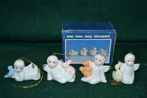 Adornos de árbol de Navidad de ángel de porcelana de hueso sosteniendo conejito pájaro azul pato ardilla - Imagen 1 de 11