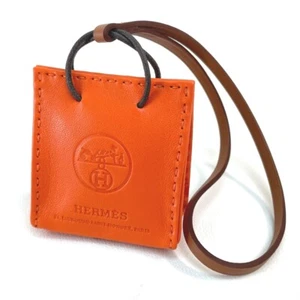 UNUSED HERMES Shopper Sac Orange strap charm Anyo Miro Orange - Picture 1 of 10