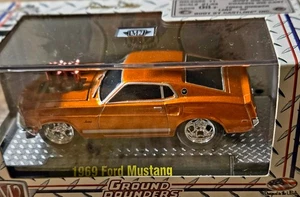 M2 GROUND POUNDERS 1/64 SCALE BURNT ORANGE 1969 FORD MUSTANG - Picture 1 of 4