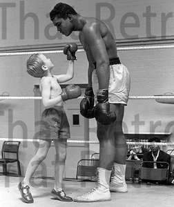 Muhammad Ali photo with kid sparing with boxing gloves - Picture 1 of 1