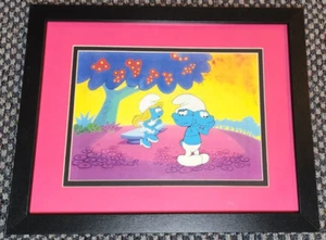SMURFS PRODUCTION ANIMATION CEL OF GROUCHY SMURF & SMURFETTE FRAMED - Picture 1 of 1