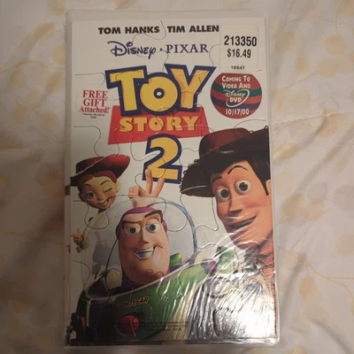 vtg Walt Disney Pixar Toy Story 2 (VHS, 1999) also includes toy Story 2 puzzle Foto 1 de 4