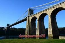 PHOTO  MENAI SUSPENSION BRIDGE TAKEN FROM THE SEAFRONT OF MENAI BRIDGE IN THE EA
