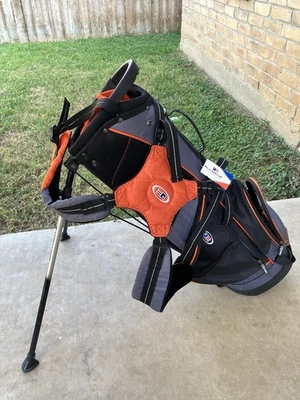 US Kids Golf Bag Ultralight Stand Carry In Black Gray and Orange New with Tags - Image 1 of 4