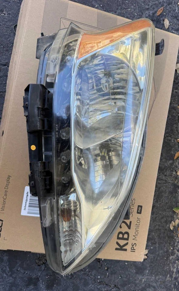 Faro derecho Nissan Sentra 2013-2015 lado del pasajero OEM Hella 26060-3SG2A Foto 1 de 4