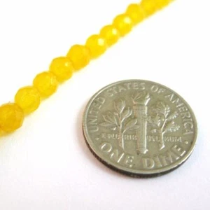 Cuentas de jade amarillo - Cuentas de piedras preciosas naturales redondas facetadas de 4 mm (se venden por hilo) - Imagen 1 de 2