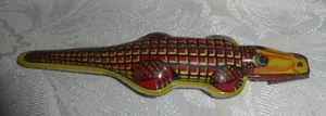 Litografía de hojalata vintage cocodrilo/caimán clicker juguete - Imagen 1 de 5