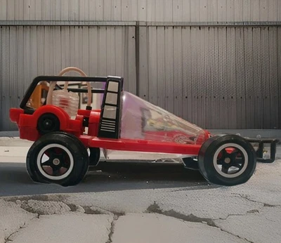 This is a Red 9.5 Inch Tomy Air Jammer Road Rammer, a vintage toy car from 1980 - Image 1 of 4