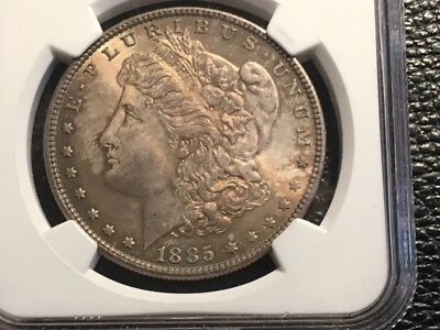 1885 morgan dollar NGC 64 unc. beautiful gold color could have graded higher - Image 1 of 4