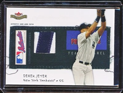 DEREK JETER 2004 FLEER PATCHWORKS LICENSED APPAREL GU JERSEY PATCH #'D 105/150 - Image 1 of 2