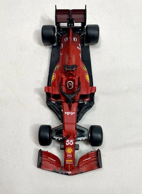 Coche de carreras Bburago Ferrari SF—23 F1 #55 Carlos Sainz escala 1/43 Fórmula 1. Suelto Foto 1 de 4