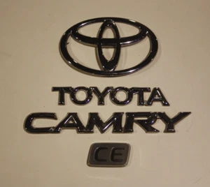 1997-2001 TOYOTA CAMRY CE REAR TRUNK DECK LID CHROME EMBLEM SET COMPLETE OEM - Picture 1 of 1