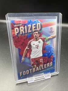 23-24 Topps Finest - Prized Footballers #PFF-9 Thomas Muller Fusion Red Blue /50 - Bild 1 von 2