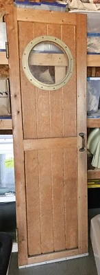 PUERTA DE MADERA con OJO DE BUEY 22x75 Foto 1 de 4