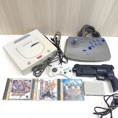Sega Saturn Console with Virtua Gun, Virtus Stick, 3 games & memory Japan white - Image 1 of 4