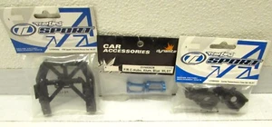 Losi Mini LST Dynamite Front C-hubs Alu Blue & Transmission case / Chassis brace - Picture 1 of 2