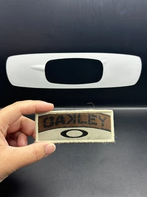 Oakley Patch SI Gancho Lazo Elipse “Moral” Dorado/Negro/Marrón Foto 1 de 3