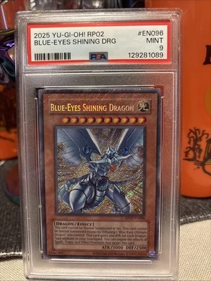 **PSA 9** Blue Eyes Shining Dragon 2025 Bleeding Foil Secret Rare RP02-En096 - Image 1 of 2