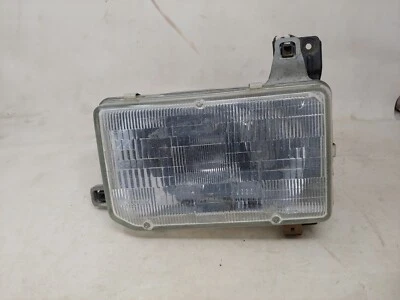 Faro lado izquierdo del conductor OEM 1987 88 89 90 91 92 93 94 95 Nissan Pathfinder Foto 1 de 4