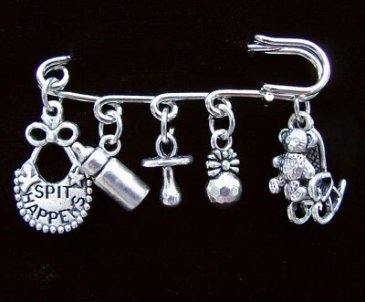 SPILLA KILT BAMBINO, 3-D Charms sonaglio, bottiglia, pettorale, dondolo, seggiolone, blocchi, orso - Immagine 1 di 4