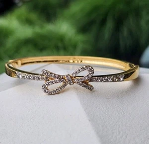 Swarovski Swan Logo Signed Clear Crystal Pave Bow Gold Plated Bangle Bracelet - Picture 1 of 15