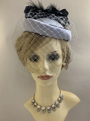 Vintage 1960s Grey Polyester Pillbox Hat With Large Black Feather Spray To Side - Image 1 of 4