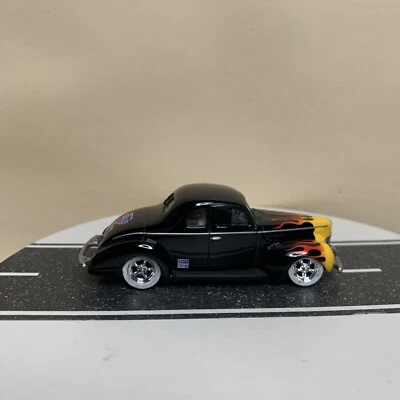Car Quest Auto Parts ‘40 Ford Coupe Street Rod Black w/Flames & White Walls 1:64 - Image 1 of 4