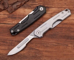 Coltello Pieghevole Utilità Portatile Taglia Carta Bisturi Lama Campeggio Esterno EDC - Foto 1 di 16