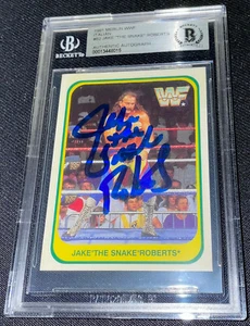 JAKE THE SNAKE ROBERTS SIGNED 1991 MERLIN WWF #82 BECKETT AUTHENTICATED 015 - Picture 1 of 2