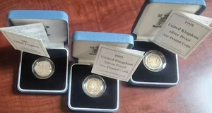 Set of 3 UK 1990, 1995 & 1998 .925 Silver Proof £1 Coins w/Cases & COAs - Picture 1 of 11