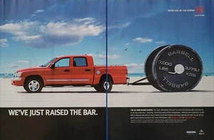 2004 - 2 PAGE PRINT AD -  DODGE DAKOTA ... WE'VE JUST RAISED THE BAR.  BARBELL - Picture 1 of 1