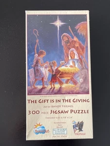 SunsOut 300 pc puzzle “The Gift Is In The Giving”- New Sealed - Picture 1 of 1