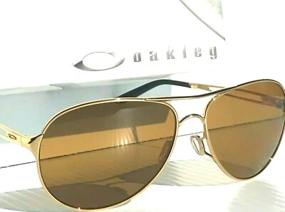 全新 * Oakley CAVEAT 金色闪亮偏光青铜女式飞行员太阳镜 4054 — 第 1/4 张图片