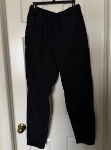 Pantalones Nike Tech para hombre talla mediana tejidos UV pierna cónica FZ0758-010 negros/negros NUEVO - Imagen 1 de 12