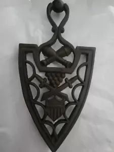 VINTAGE CAST IRON TRIVET SWORDS AND BADGE 8" - Picture 1 of 3