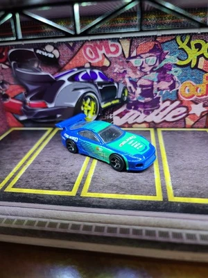 2014 HOT WHEELS TOYOTA SUPRA FALKEN BLUE & GREEN 1:64 DIECAST 2 7/8" RACE CAR - Image 1 of 4