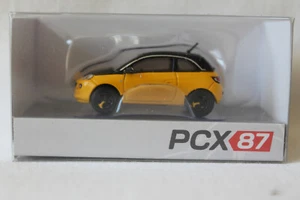 PCX87: 870618 Opel Adam gelb-schwarz 2013 - Picture 1 of 5