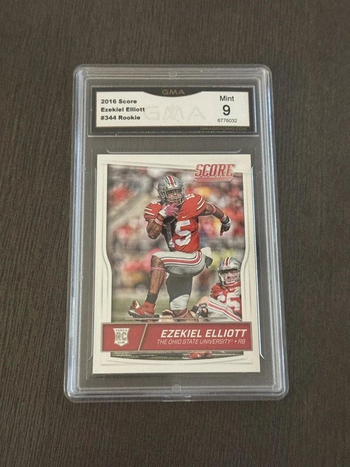 2016 Panini Score Rookies #344 EZEKIEL ELLIOTT Rookie RC - Graded GMA 9 MINT MT - Image 1 of 3