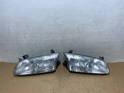 Faros delanteros izquierdo+derecho Toyota Camry 2000 a 2001 OEM U9983 DW Foto 1 de 4