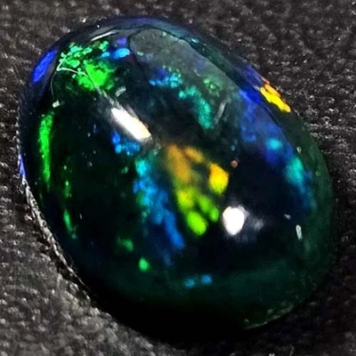 NATURAL AAA+ JUEGO DE COLORES SUPERIOR OVALADO CABUCHAN ETÍOPE WELO ÓPALO NEGRO 1,50 CTS Foto 1 de 3