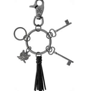 Disney Keychain Pirates Of The Caribbean Jailer Key Ring Skeleton Tassel Charm - Picture 1 of 3